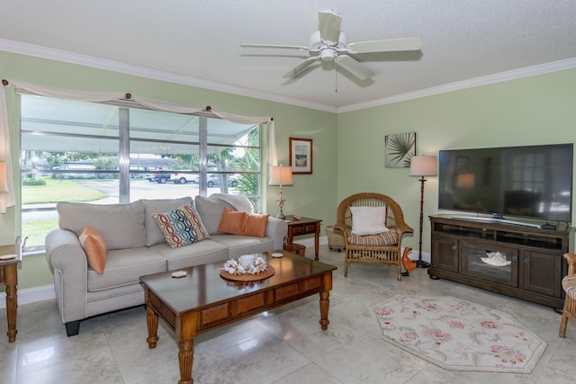 living room with ornamental molding, ceiling fan, and a healthy amount of sunlight