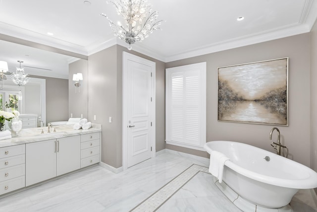 bathroom featuring vanity, an inviting chandelier, a bathtub, and crown molding