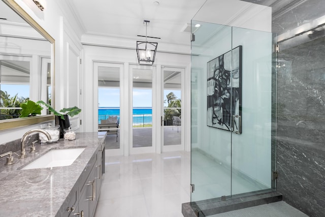 bathroom featuring tile patterned flooring, crown molding, a water view, and walk in shower