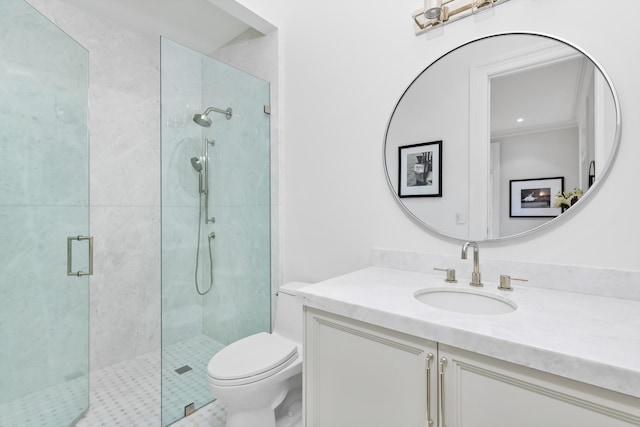 bathroom with vanity, toilet, and a shower with shower door