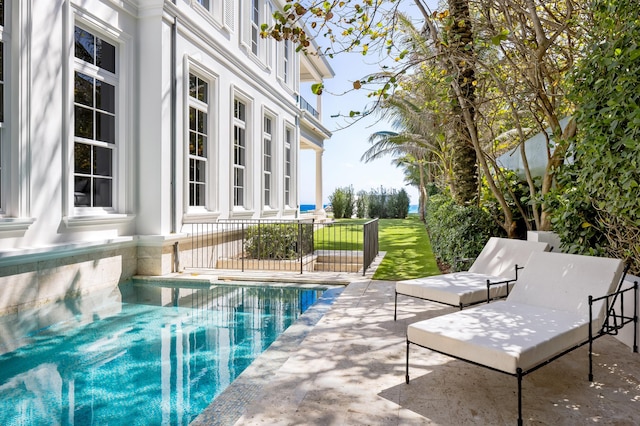 view of swimming pool featuring a patio