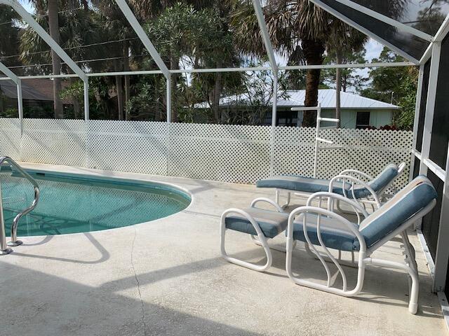 view of pool featuring a lanai and a patio area