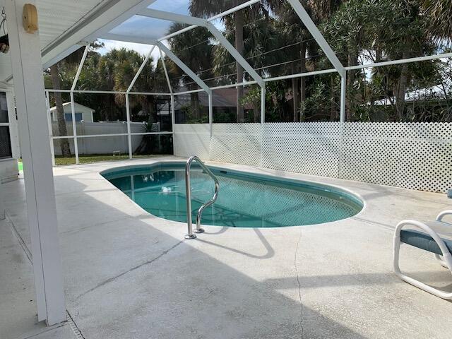 view of pool featuring a lanai and a patio area