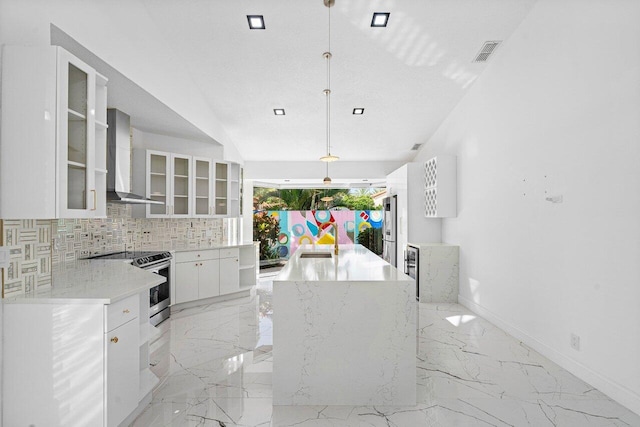 kitchen with stainless steel electric range oven, white cabinetry, wall chimney exhaust hood, tasteful backsplash, and pendant lighting