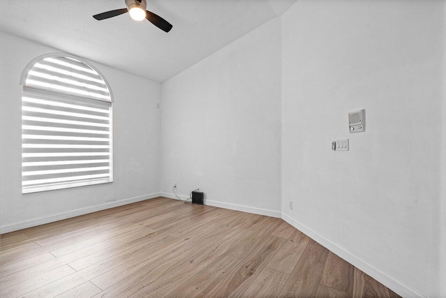 empty room featuring a textured ceiling, light hardwood / wood-style flooring, and ceiling fan