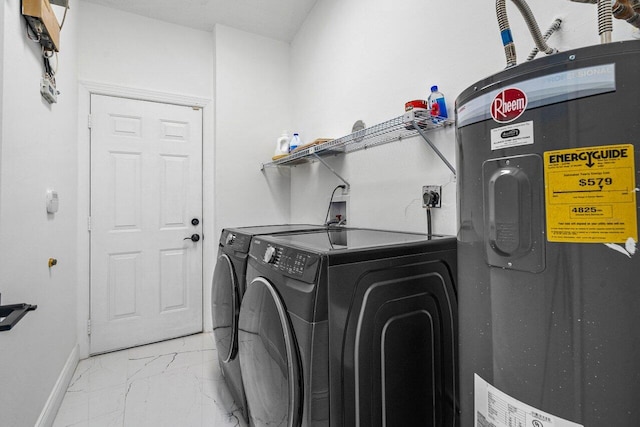 washroom featuring washing machine and clothes dryer and water heater