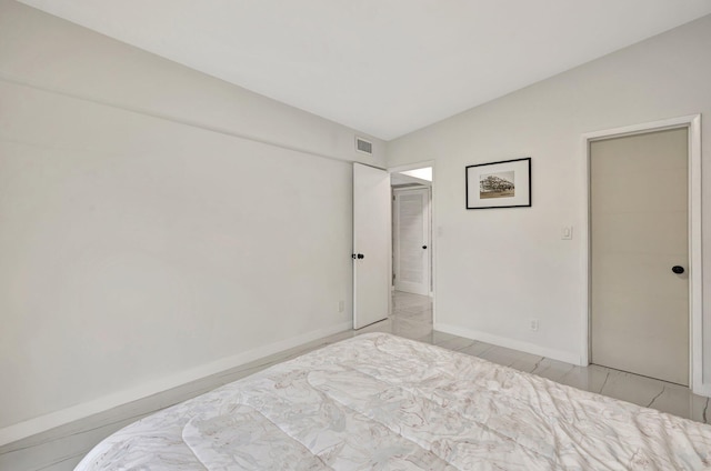 bedroom featuring lofted ceiling