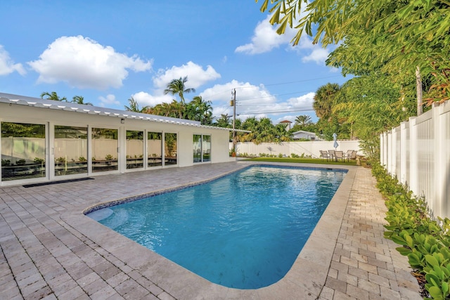 view of swimming pool featuring a patio