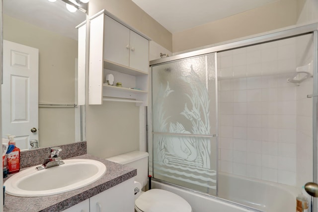 full bathroom with shower / bath combination with glass door, vanity, and toilet