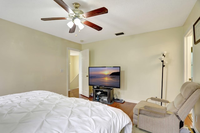 bedroom with ceiling fan and light hardwood / wood-style flooring