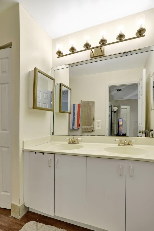 bathroom featuring hardwood / wood-style floors and vanity