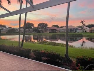 surrounding community featuring a water view and a yard