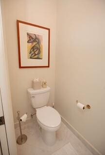 bathroom featuring tile patterned floors and toilet