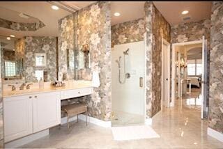 bathroom with vanity and walk in shower