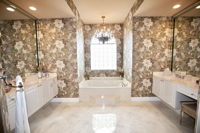 bathroom featuring a bathing tub, vanity, and a chandelier