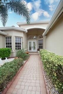 property entrance featuring french doors