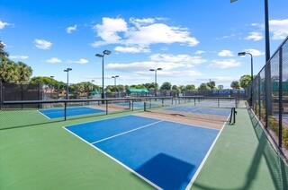 view of tennis court featuring basketball hoop