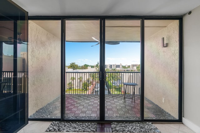 interior space featuring tile patterned flooring and a wall of windows