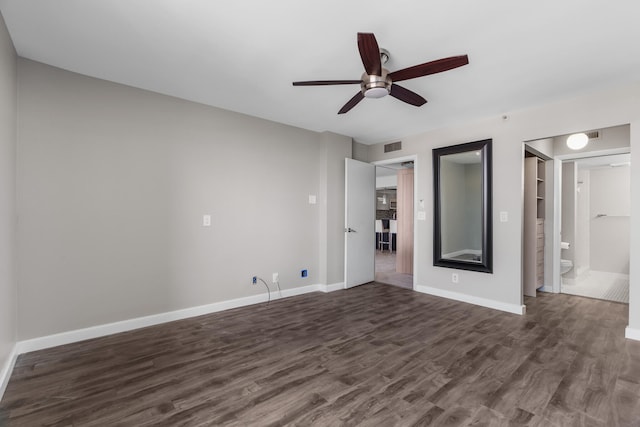 unfurnished living room with ceiling fan and dark wood-type flooring