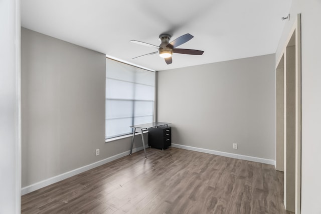 unfurnished bedroom featuring hardwood / wood-style floors and ceiling fan