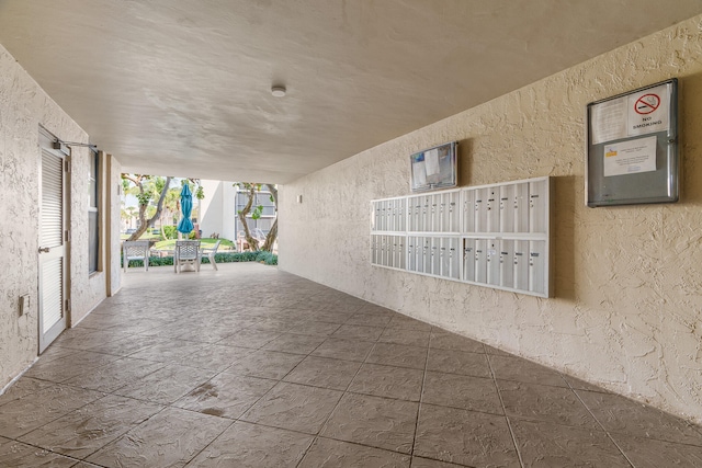 view of patio / terrace with a mail area