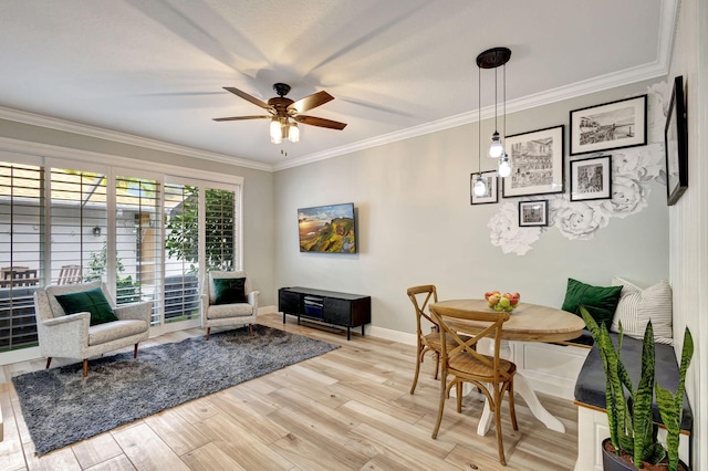 interior space featuring ceiling fan, light hardwood / wood-style floors, and ornamental molding