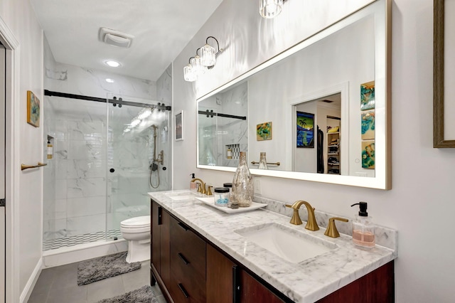 bathroom with toilet, vanity, tile patterned floors, and walk in shower