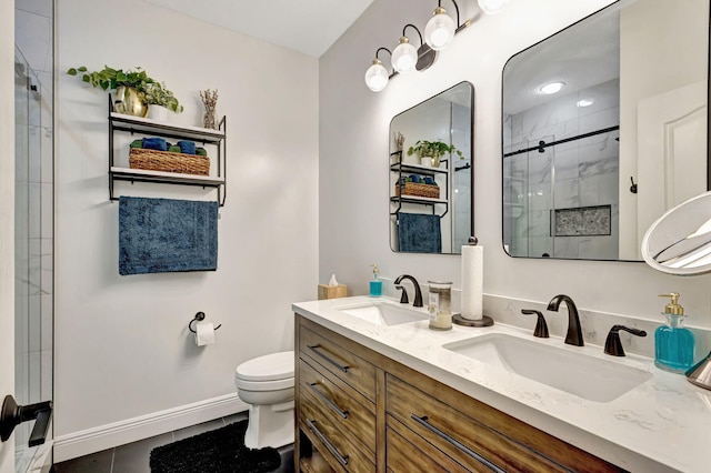 bathroom with tile patterned floors, toilet, an enclosed shower, and vanity