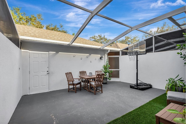 view of patio / terrace featuring a lanai