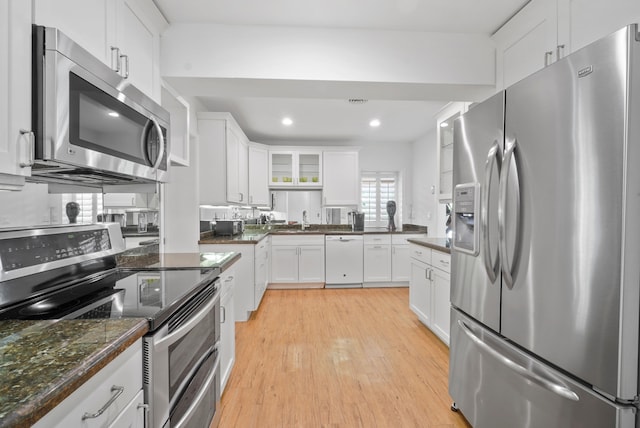 kitchen featuring white cabinets, light hardwood / wood-style floors, sink, and stainless steel appliances