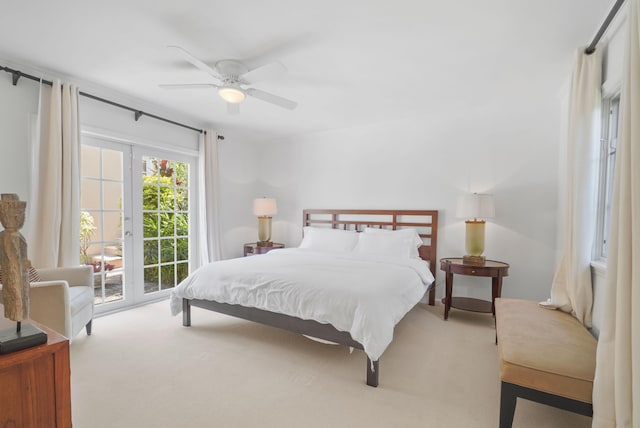 carpeted bedroom with ceiling fan and access to exterior