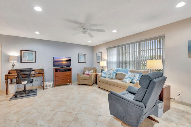 tiled living room with ceiling fan