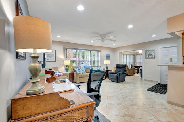 office area with ceiling fan and light tile patterned floors