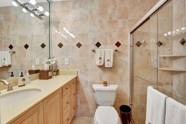 bathroom featuring vanity, an enclosed shower, tile walls, and toilet