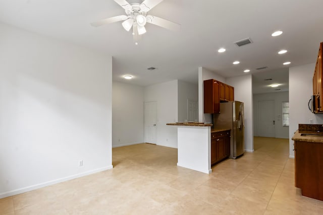 kitchen with ceiling fan, light tile patterned floors, and appliances with stainless steel finishes