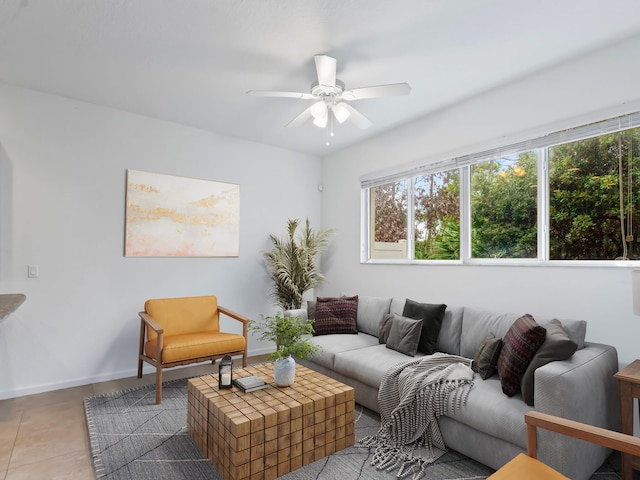 living room featuring ceiling fan and light tile patterned floors