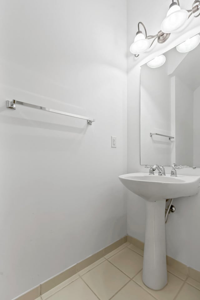 bathroom with tile patterned floors