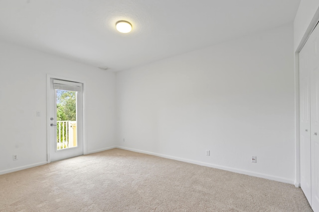 spare room with light carpet