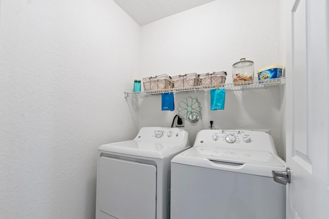 washroom featuring washer and clothes dryer