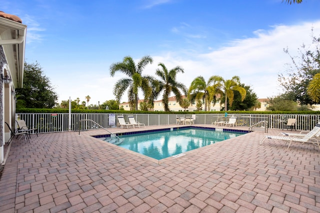 view of swimming pool featuring a patio area