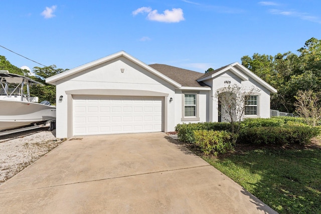 ranch-style home featuring a garage