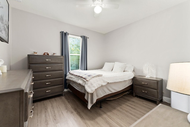 bedroom featuring ceiling fan and light hardwood / wood-style flooring