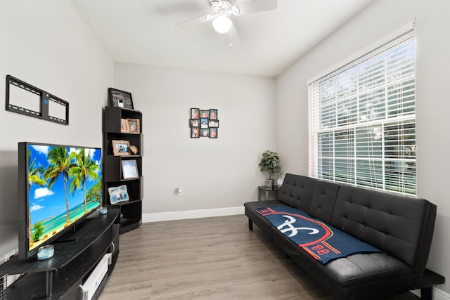 living room with hardwood / wood-style floors and ceiling fan