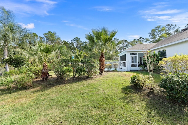 view of yard featuring a sunroom