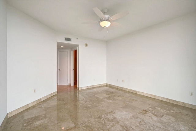 spare room with ceiling fan