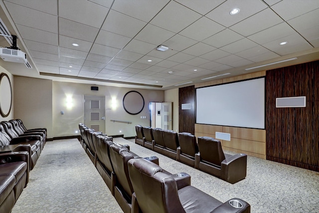 cinema with wooden walls and light colored carpet