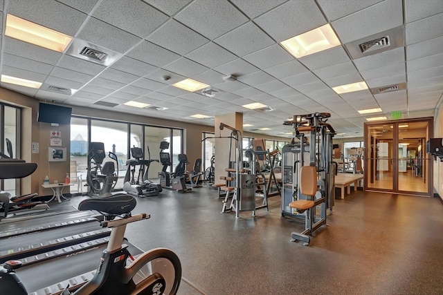 exercise room featuring a drop ceiling