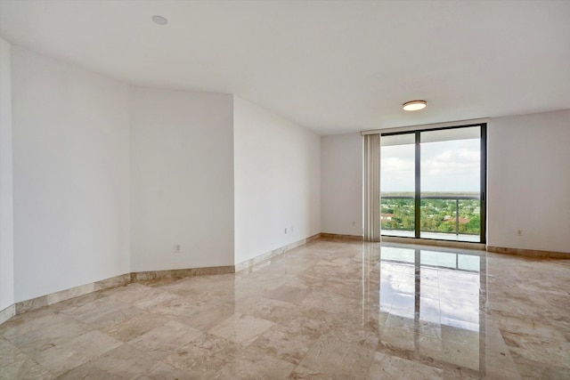 empty room featuring floor to ceiling windows