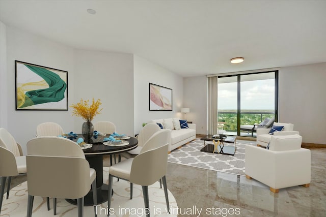 dining area featuring a wall of windows