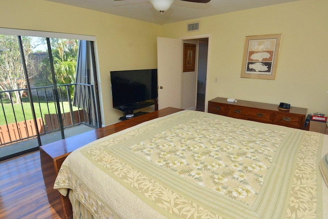 bedroom featuring access to exterior, hardwood / wood-style floors, and ceiling fan